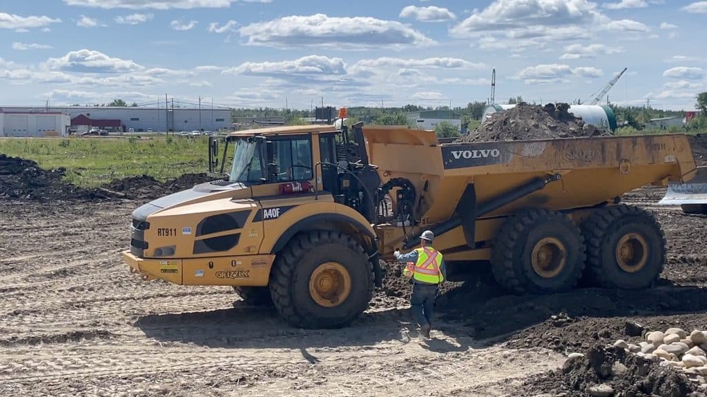 An experienced operator provides instruction for a student during Project Heavy Duty.