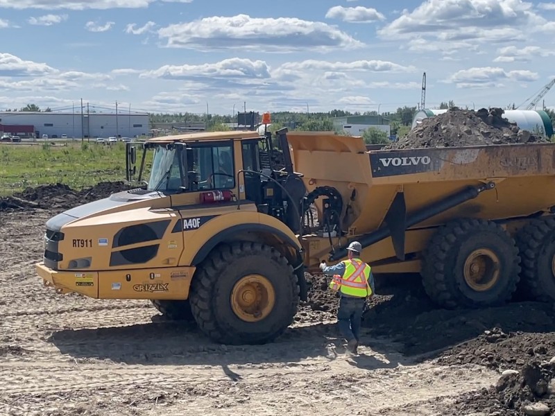 An experienced operator provides instruction for a student during Project Heavy Duty.