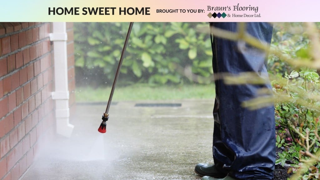 A person pressure washing their house