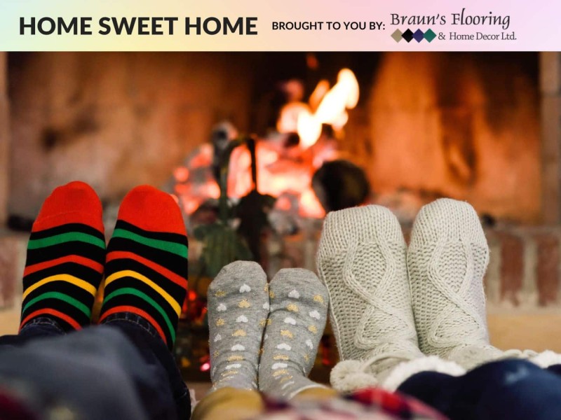 People warming their feet by a fire