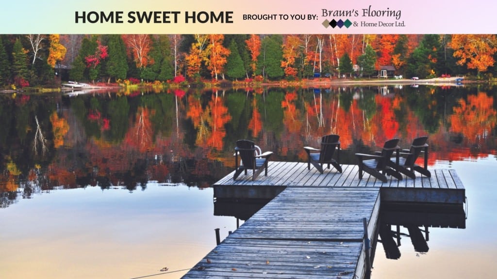 A dock on a lake surrounded by trees