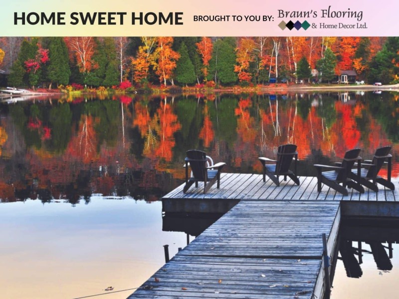 A dock on a lake surrounded by trees