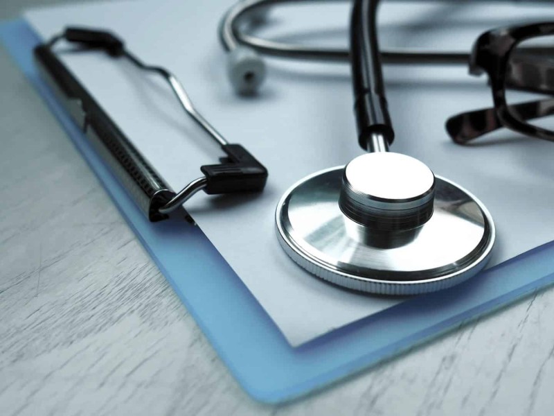A stethoscope on a clipboard.