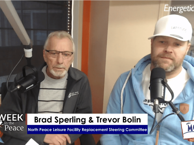 Two people recording a podcast