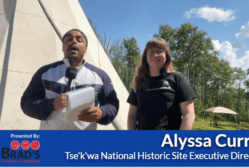 Two people smiling at the camera