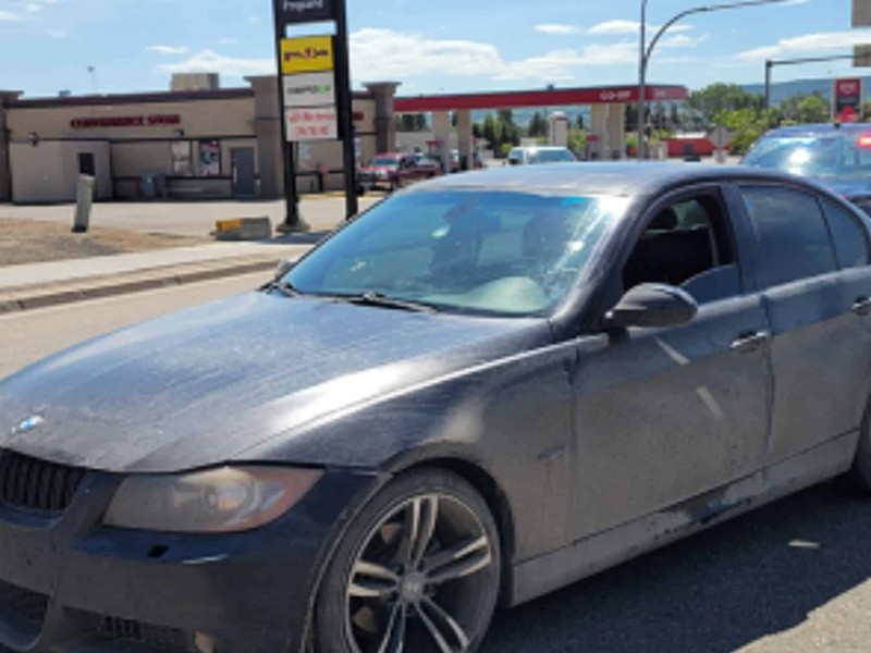 Terrence Gibson is accused of fleeing from police in Dawson Creek in this black sedan. - Dawson Creek RCMP
