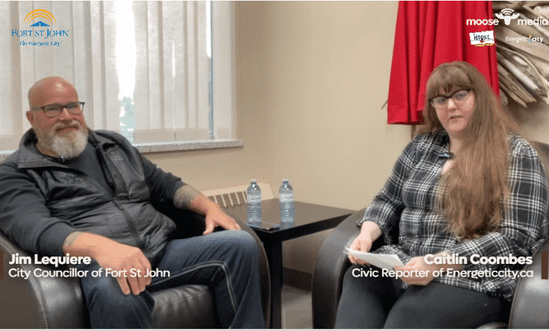 Two people smiling at the camera