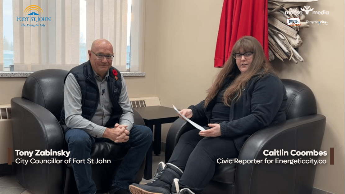 Two people smiling at the camera