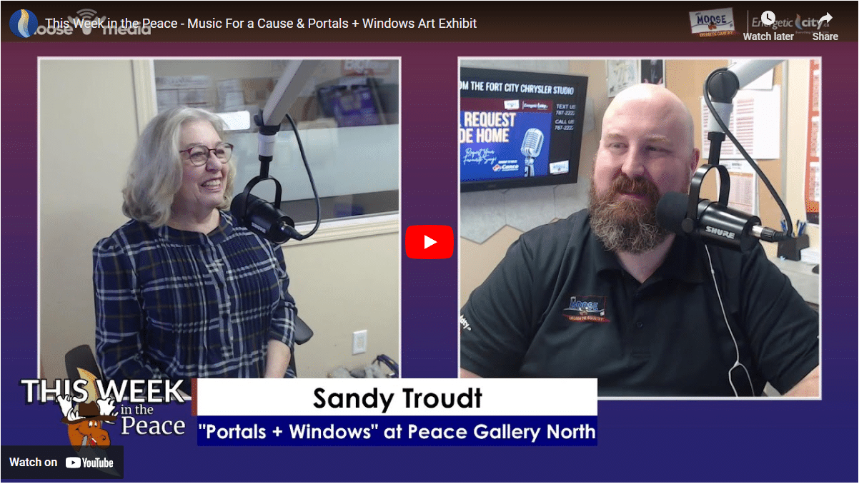 Two people smiling at the camera