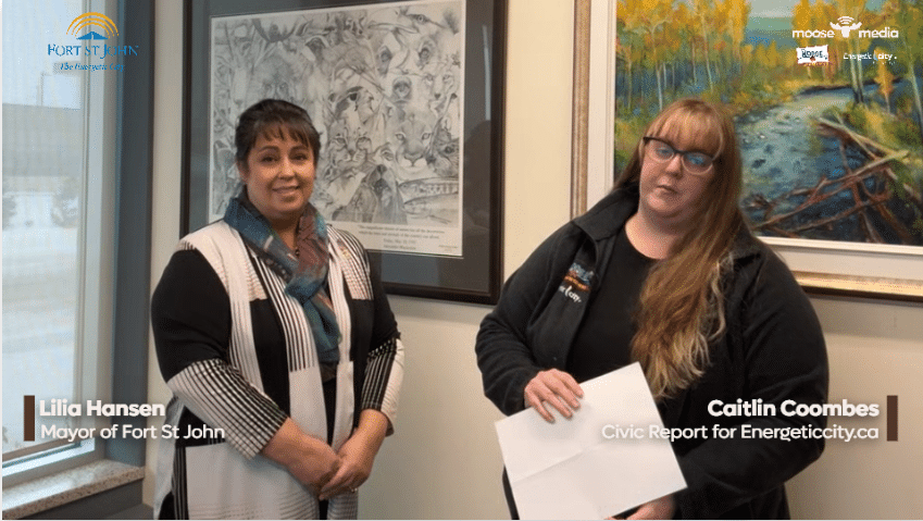 Two people smiling at the camera