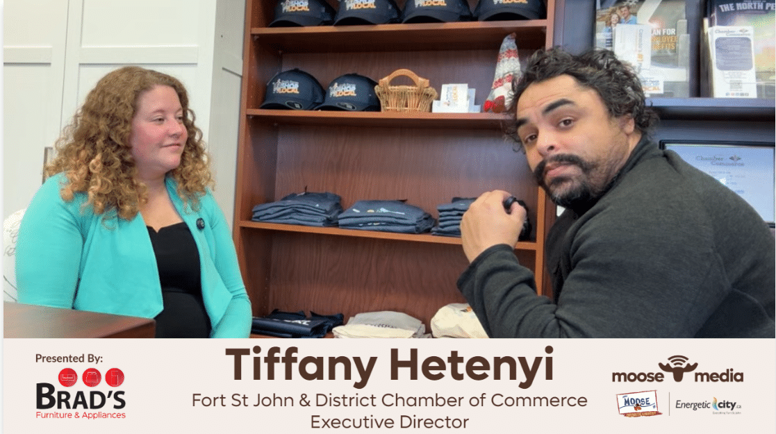 Two people smiling at the camera