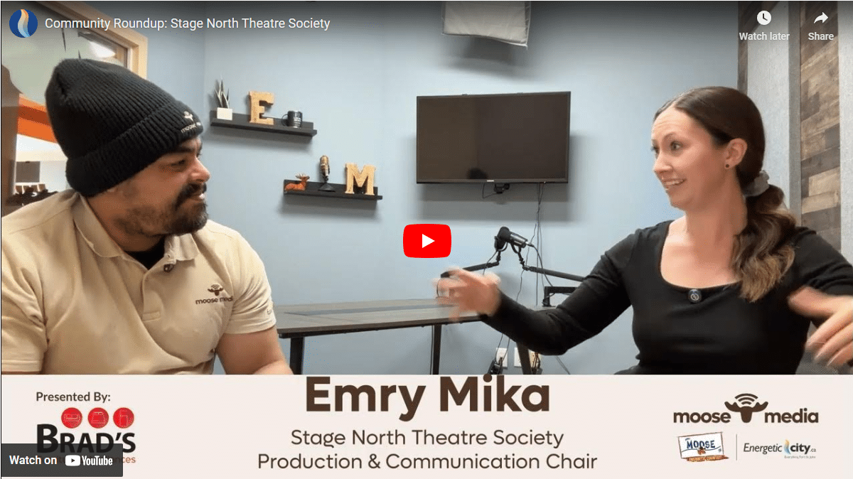 Two people smiling at the camera