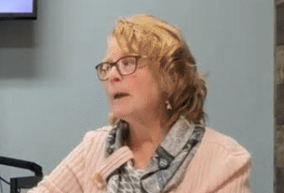 Two people smiling at the camera