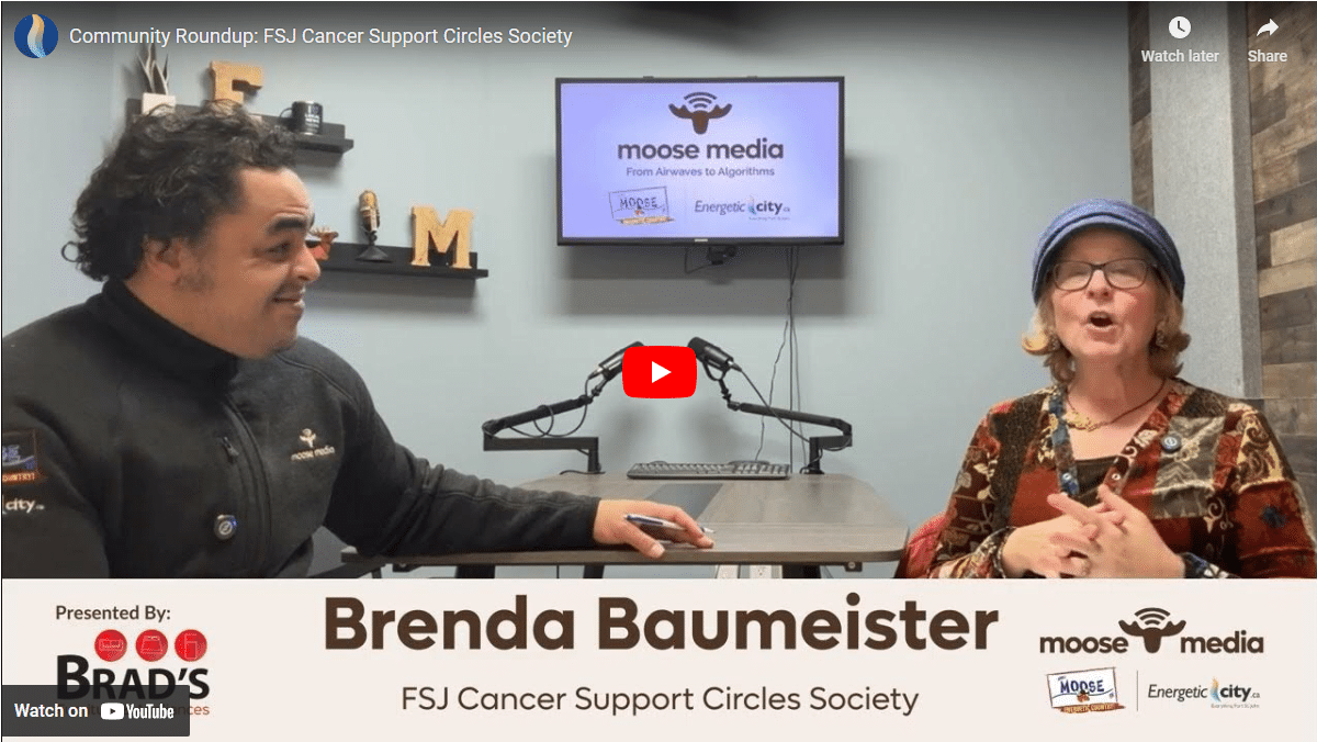 Two people smiling at the camera