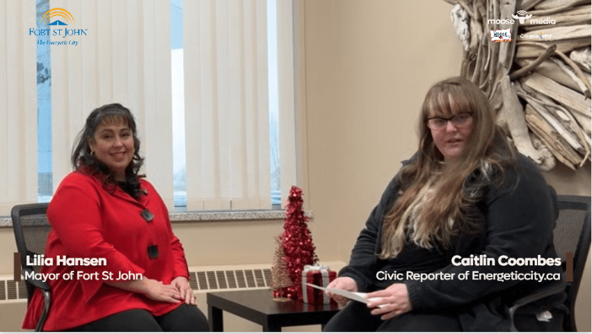 Two people smiling at the camera