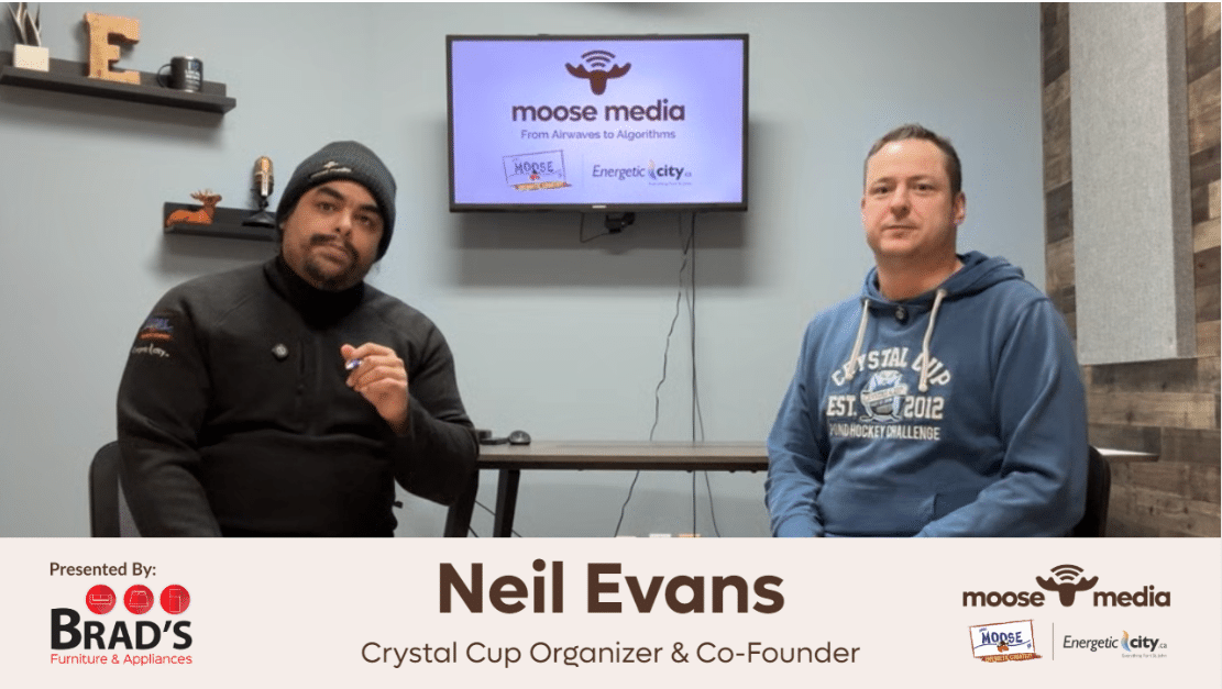 Two people smiling at the camera