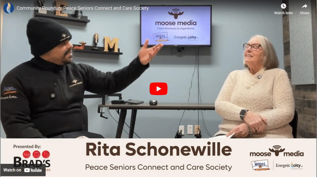 Two people smiling at the camera