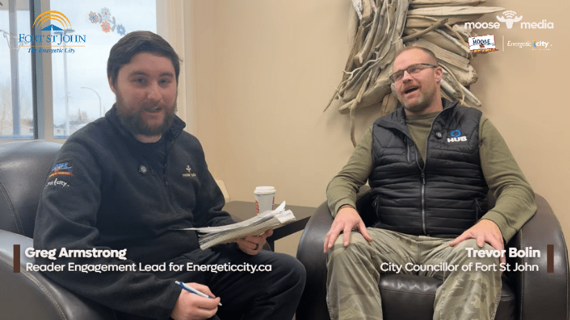 Two people smiling at the camera