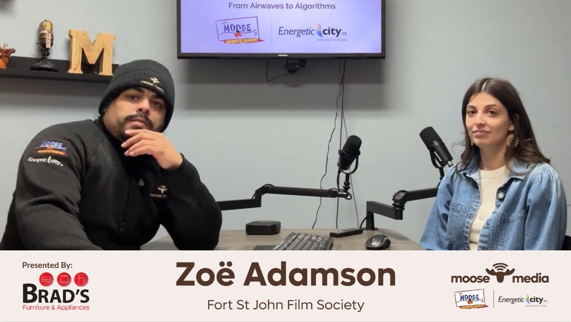 Two people smiling at the camera