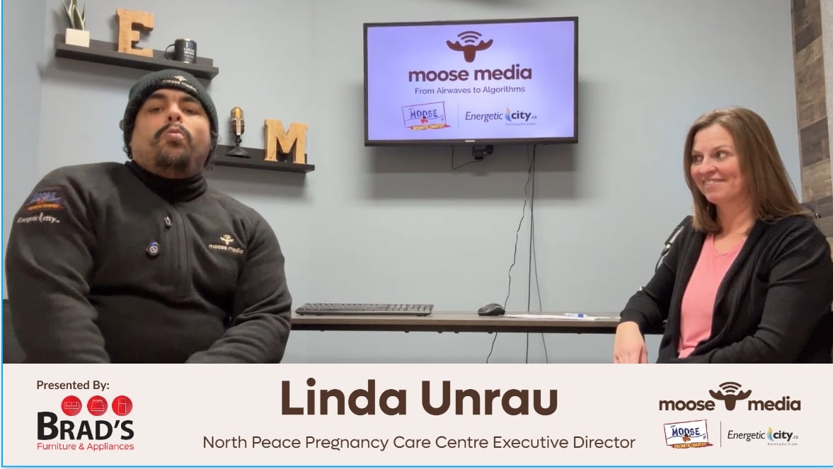 Two people recording a podcast