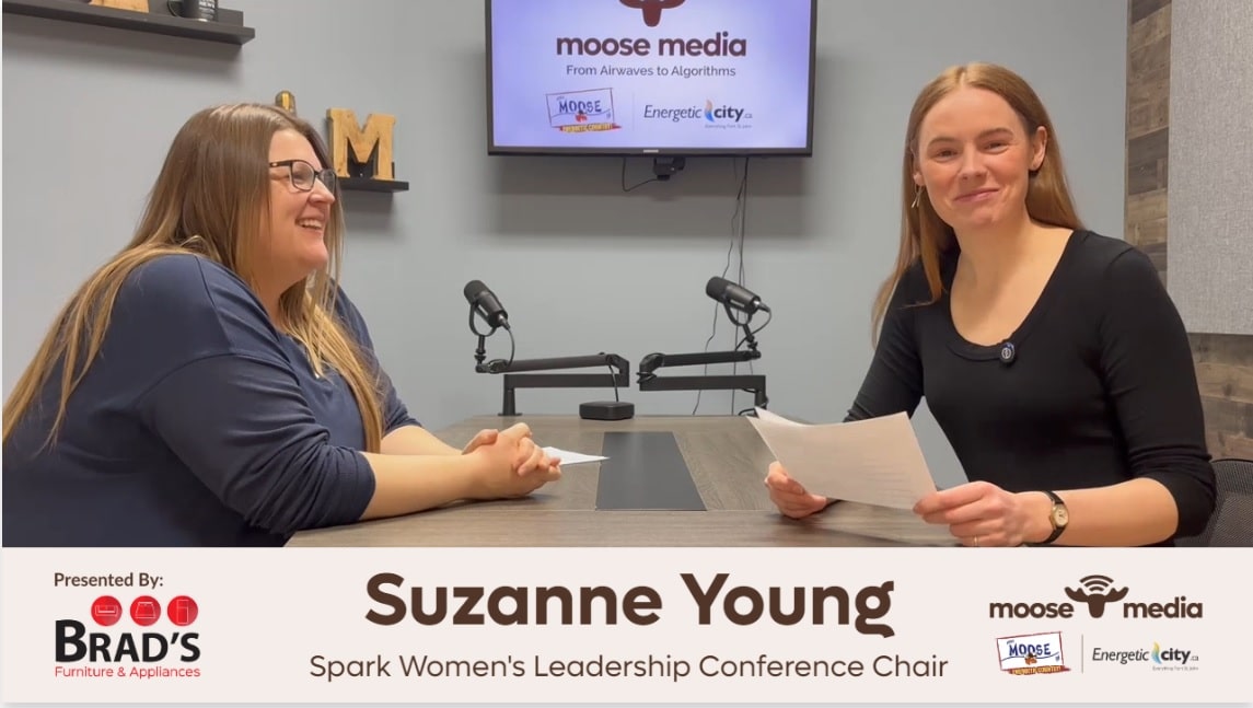 Two people smiling at the camera