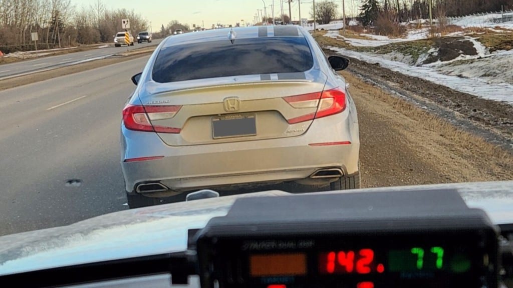 A sedan by the side of the road, which BC Highway Patrol says was being driven by a class seven 'novice' who was ticketed for failing to display their N-plate. (BC Highway Patrol)