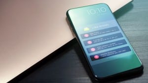 A cell phone with a series of scam text message notifications on the screen.