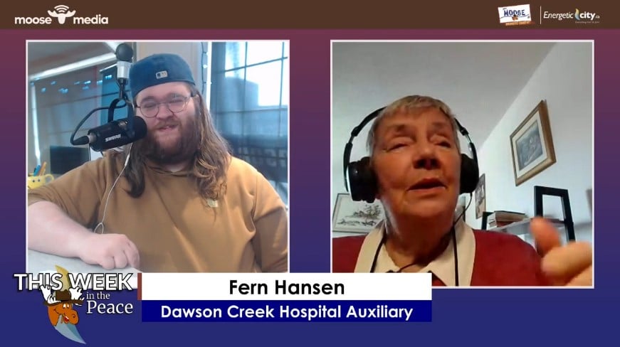 Two people smiling at the camera