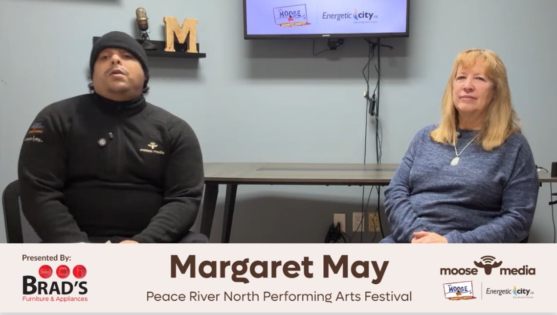 Two people smiling at the camera