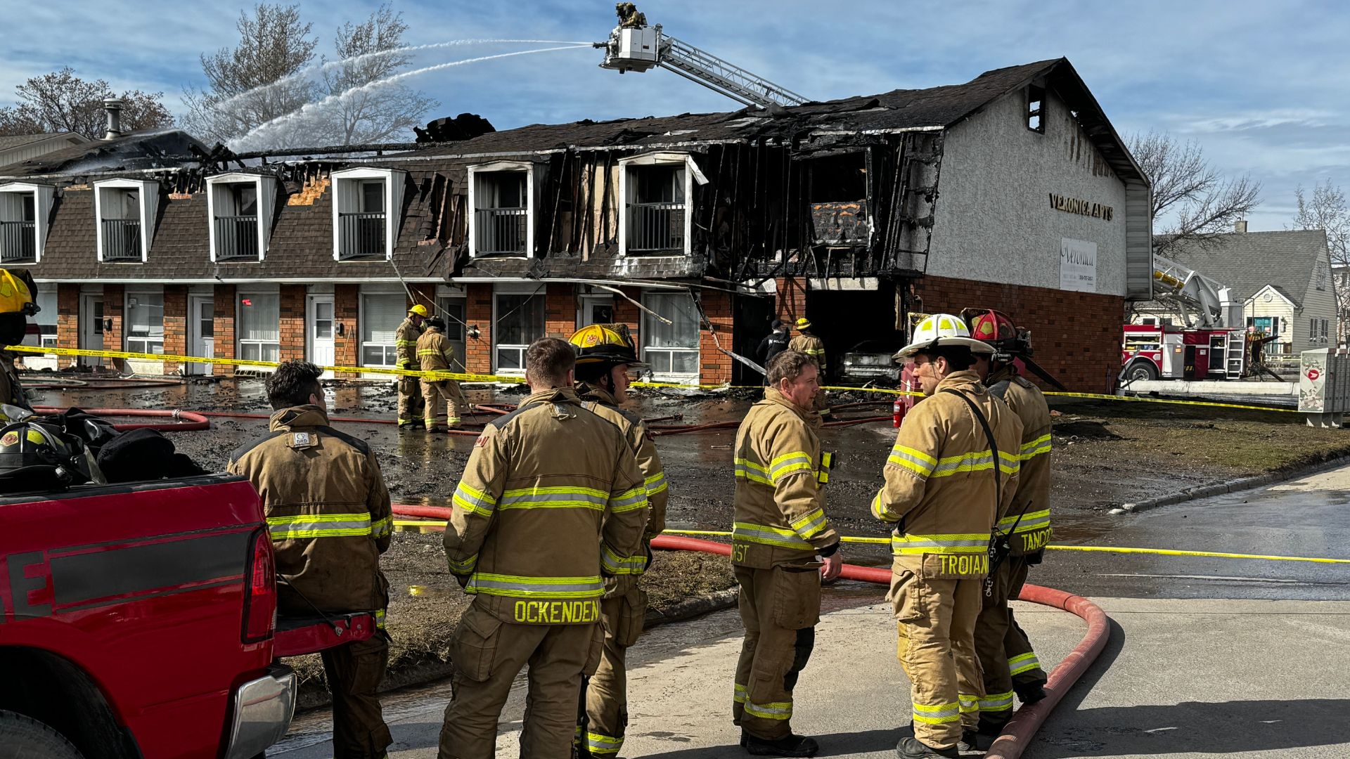 Firefighters outside the building on 103rd Avenue. (Franki Berry/Energeticcity.ca)