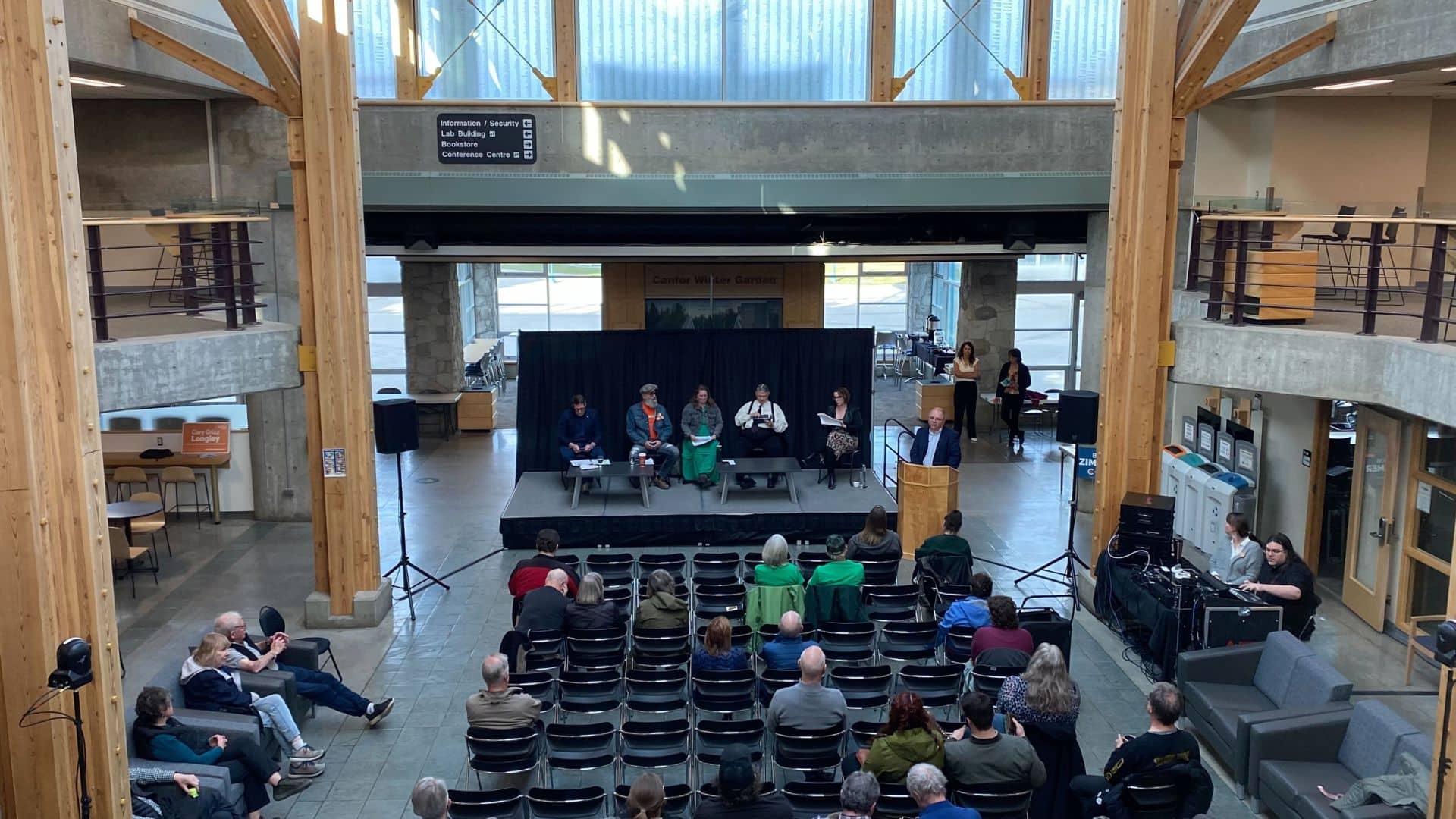 Candidates for the Prince George, Peace River and Northern Rockies riding in Prince George at the University of Northern British Columbia's all-candidates forum for the federal election 2025. Left to right: Conservative Bob Zimmer, the NDP's Cory Longley, the Green's Mary Forbes, the PPC's David Watson, and an event staff member. (Caitlin Coombes/Energeticcity.ca)