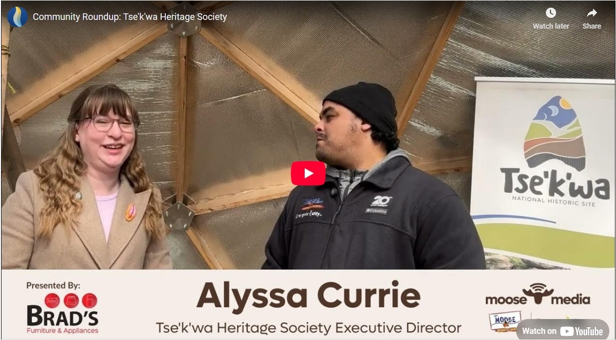 Two people smiling at the camera