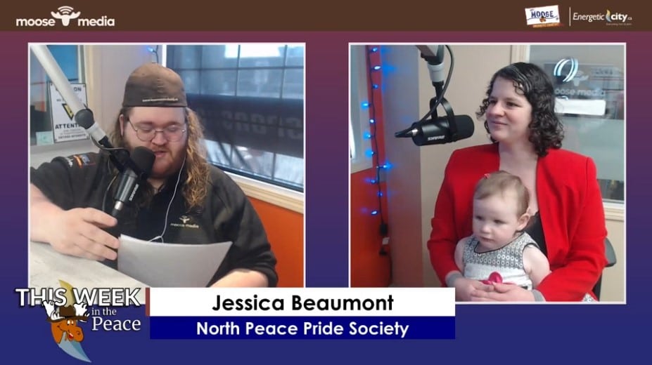 Two adults and a child smiling at the camera