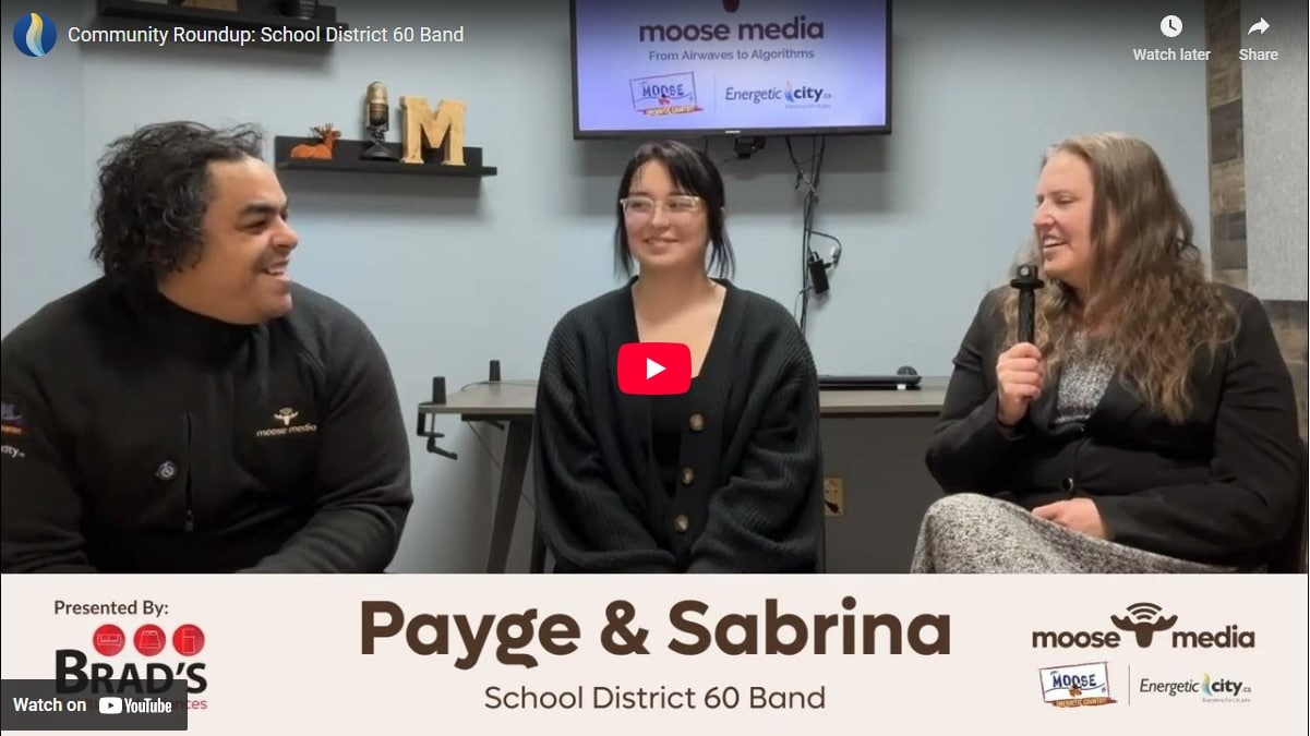 Three people smiling at the camera