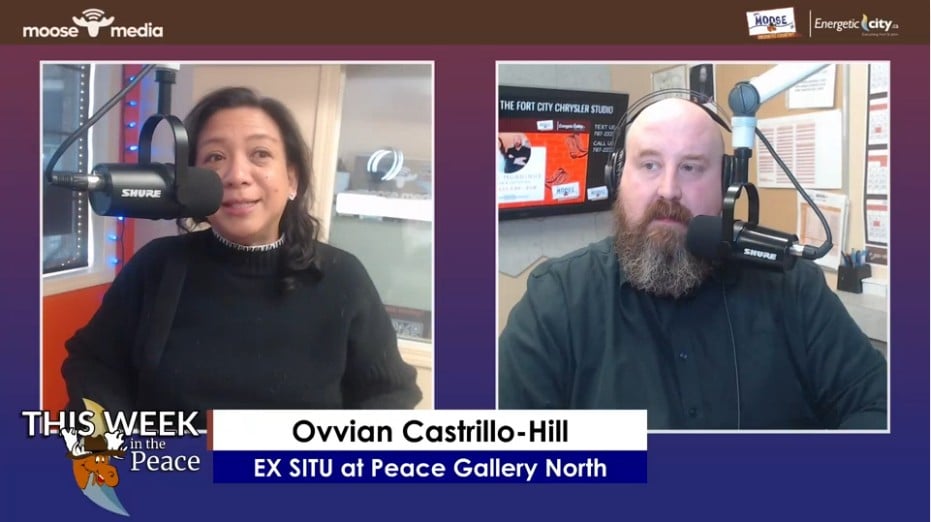 Two people recording a podcast