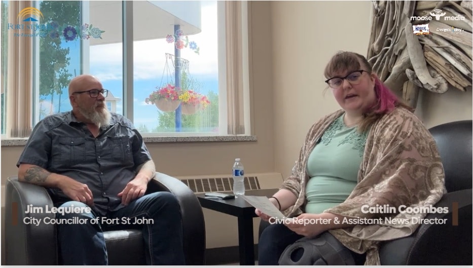 Two people smiling at the camera