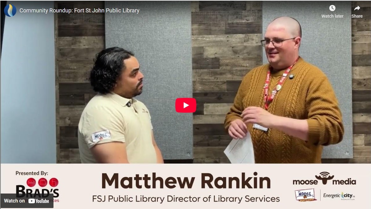 Two people smiling at the camera