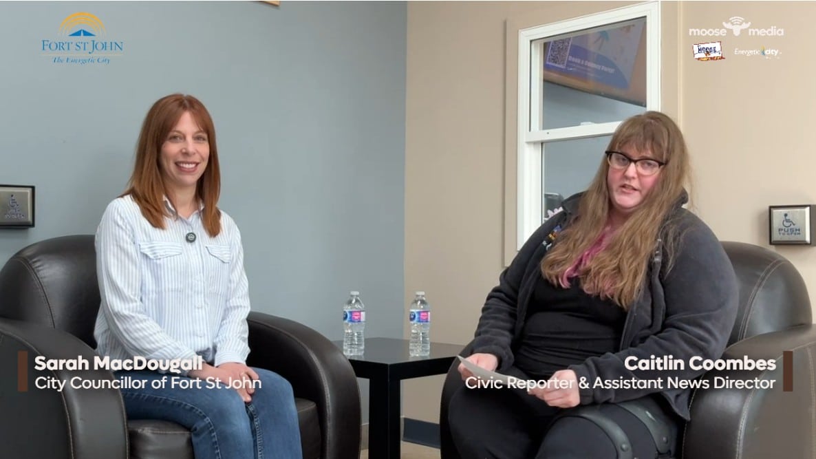 Two people smiling at the camera