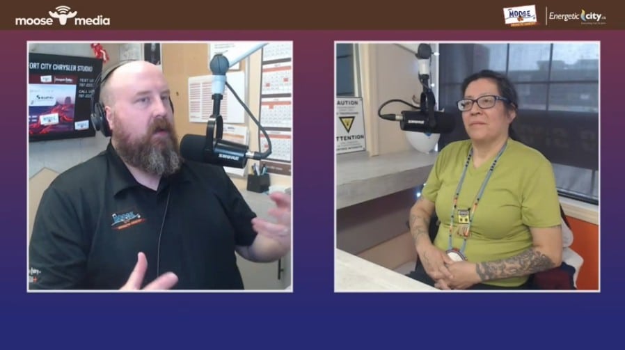 Two people recording a podcast