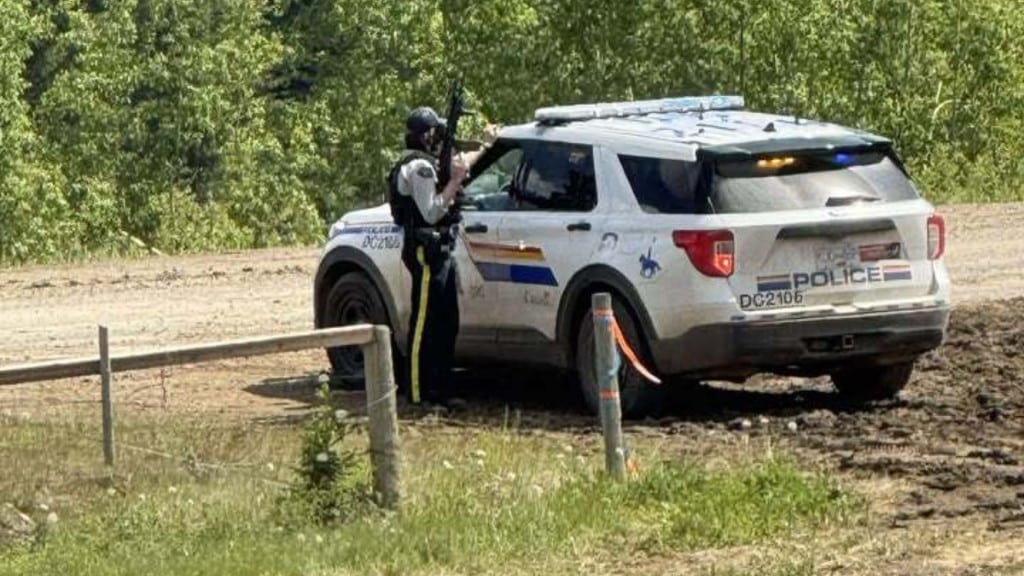 A picture of an armed police officer amid the incident which closed Highway 52. (Submitted) 