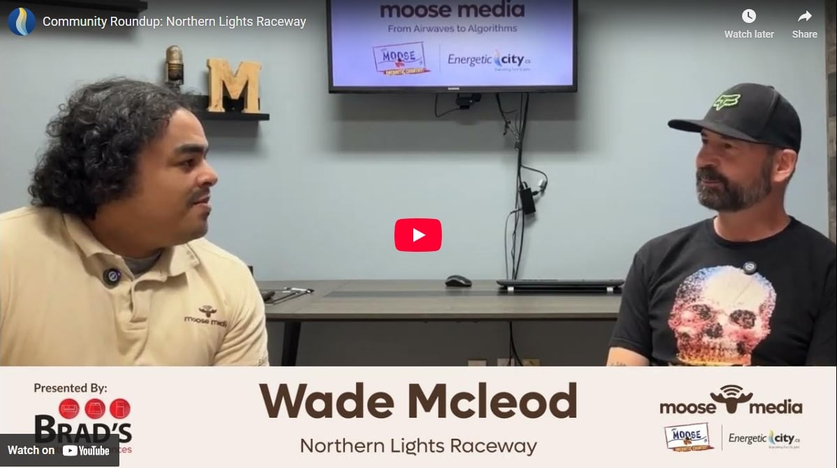 Two people smiling at the camera