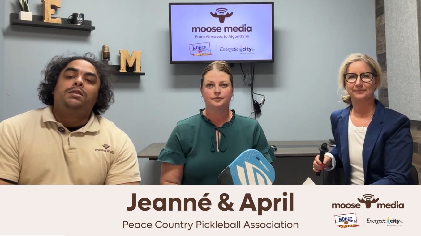 Three people smiling at the camera