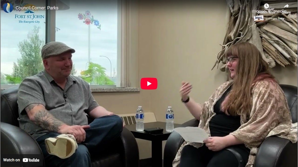 Two people smiling at the camera