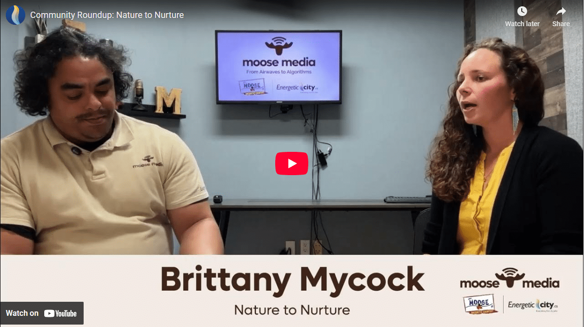 Two people smiling at the camera