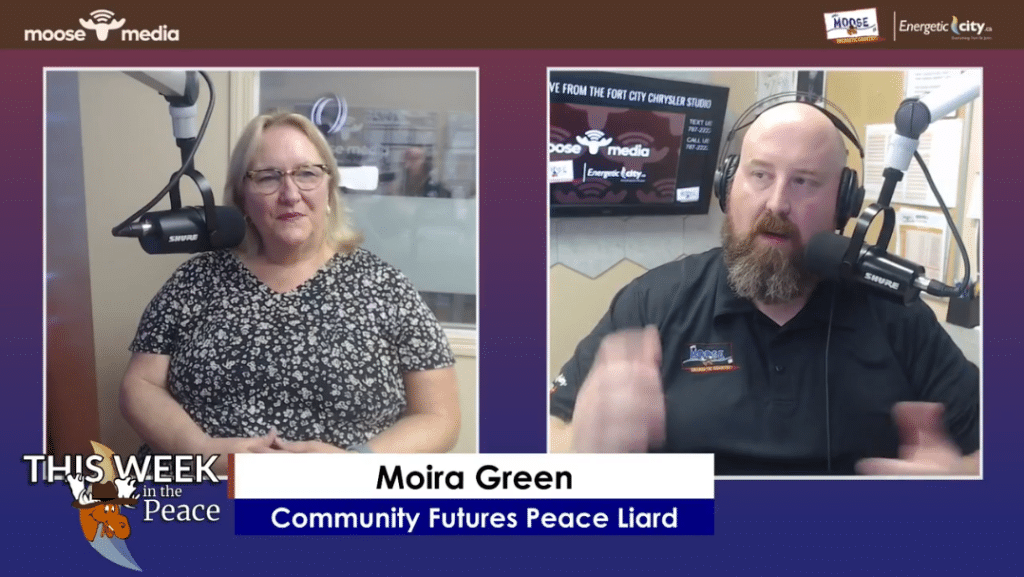 Two people smiling at the camera