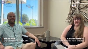 Two people smiling at the camera