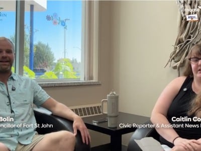 Two people smiling at the camera