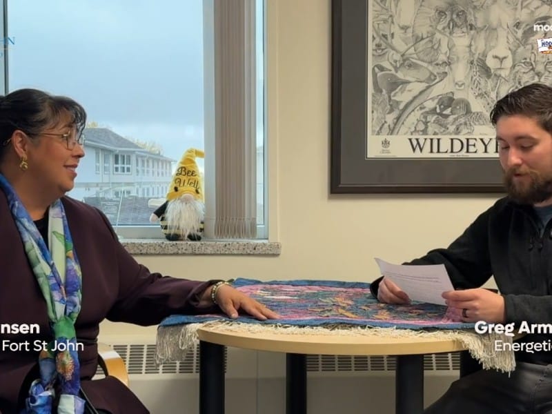 Two people smiling at the camera