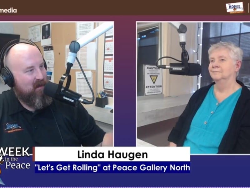 Two people smiling at the camera