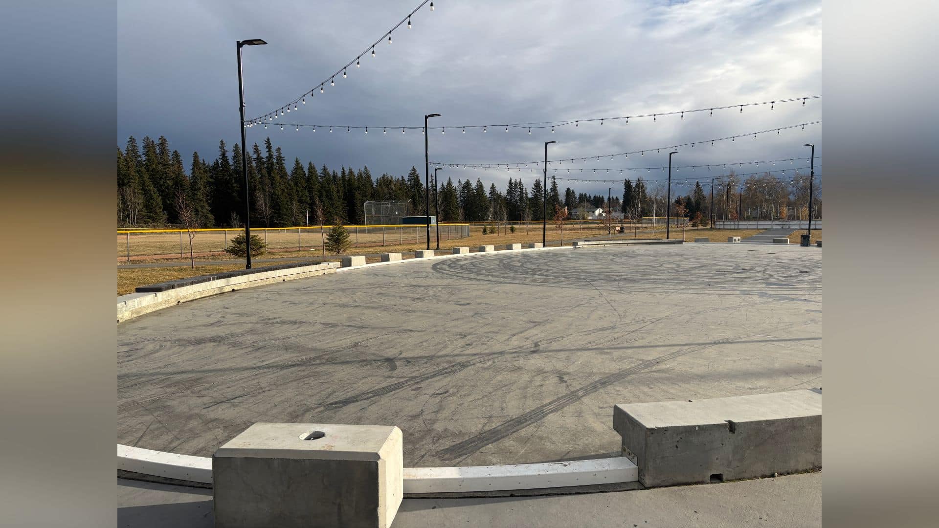 Garbage can, baseball dugout set on fire at Kin Park